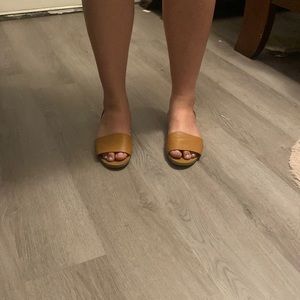 Brown and black flat sandals